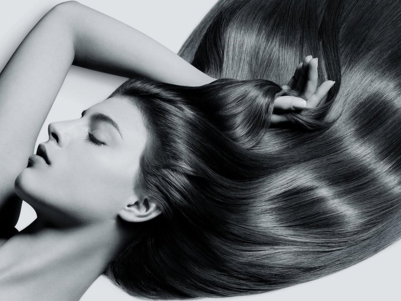 Black-and-white image of long, glossy, straight hair