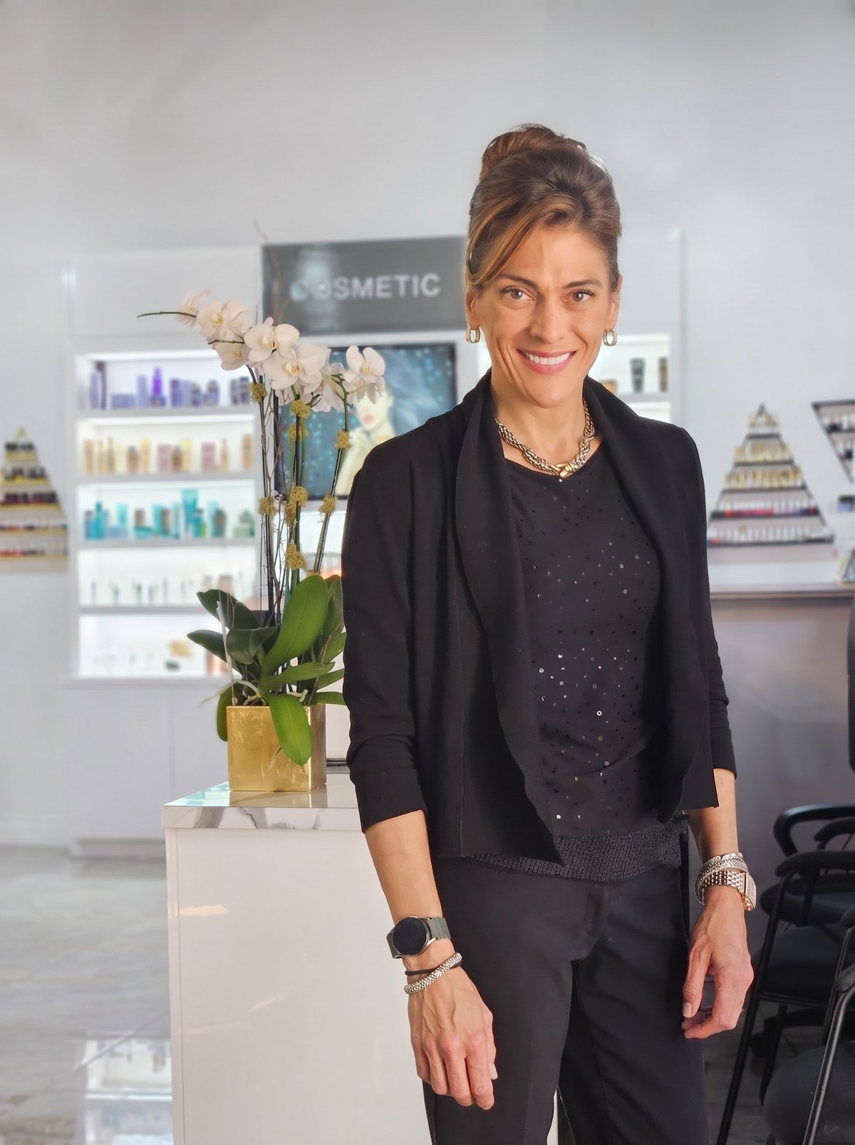 Esther Klein smiling in the salon, real photo retouched for light and color